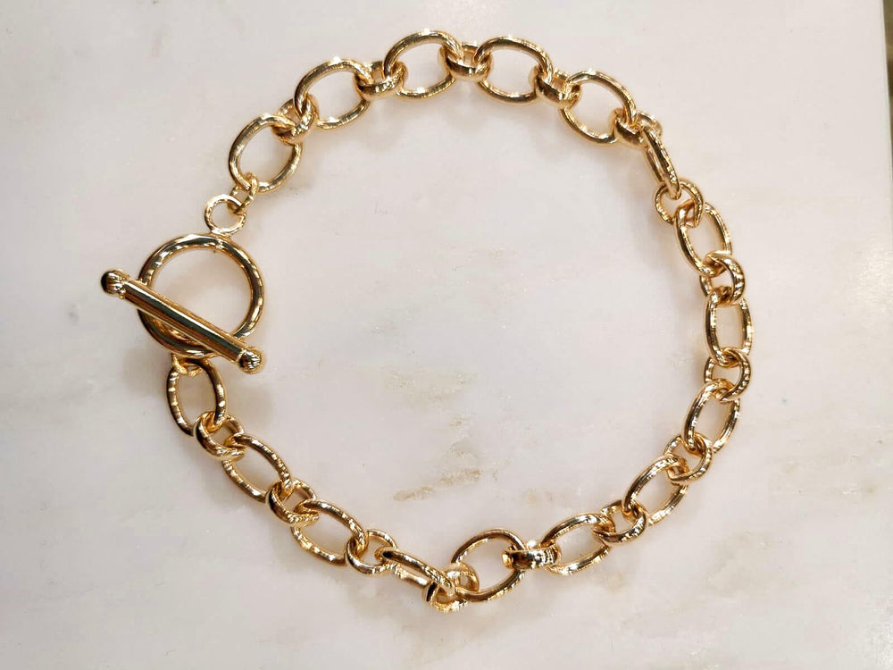 Bracelet grand maillon fermoir anneau et barrette en plaqué or 